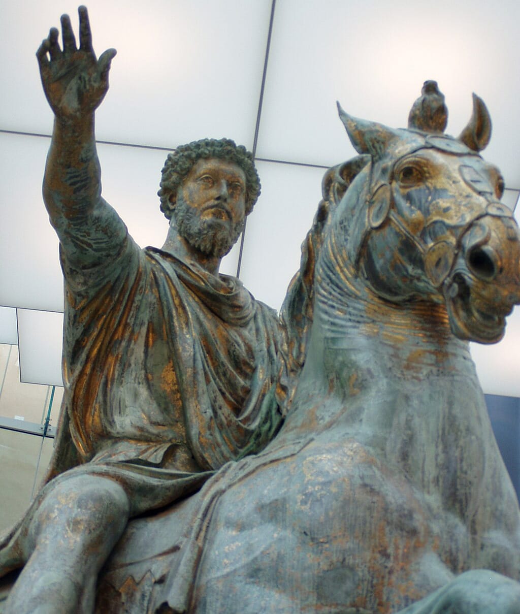 Bronze equestrian statue of Marcus Aurelius on horseback, with his arm raised in a gesture of authority. 
